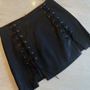 Faux leather, lace up, mini skirt. NEVER WORN